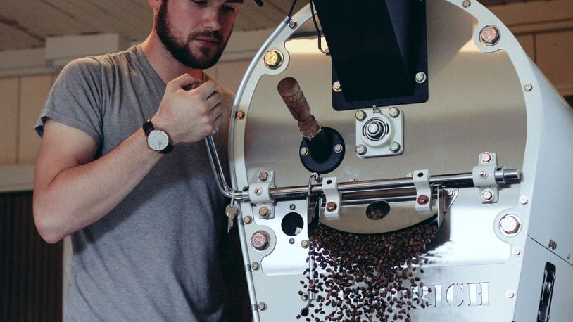 Jonathan Purcey works the roaster at Pettibone Coffee, a roastery in the Dayton area. Purcey and his mother, Marci Purcey, are planning to open a coffee shop in Riverside in February under the same name. CONTRIBUTED