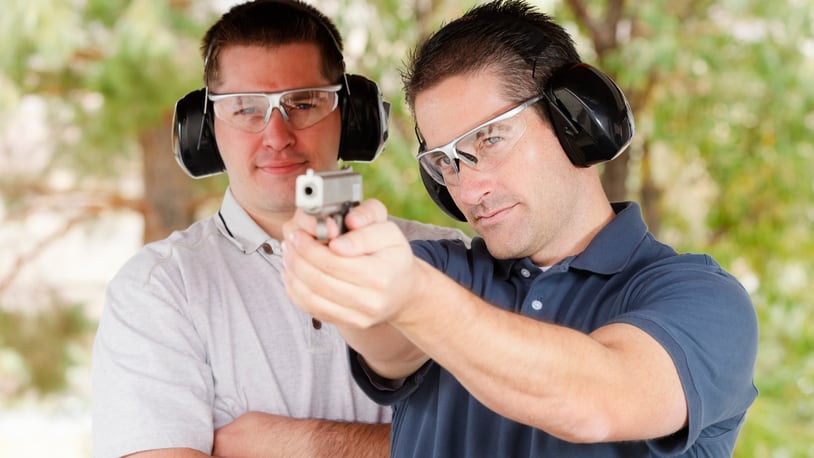 Firearms instructor and student.