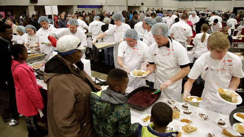 Thousands attended the Feast of Giving Thursday, an annual event held each Thanksgiving Day at the Dayton Convention Center. LISA POWELL / STAFF PHOTO
