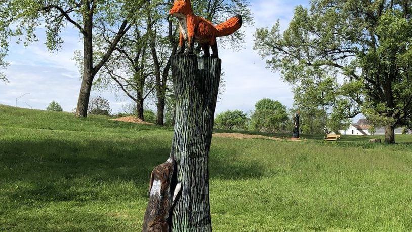 A dog park and chainsaw-carved sculptures by artist Patrick Allred of Economy, Ind., are among the recent updates at Highland Park, located at the corner of Steve Whalen Boulevard and Wyoming Avenue. CONTRIBUTED