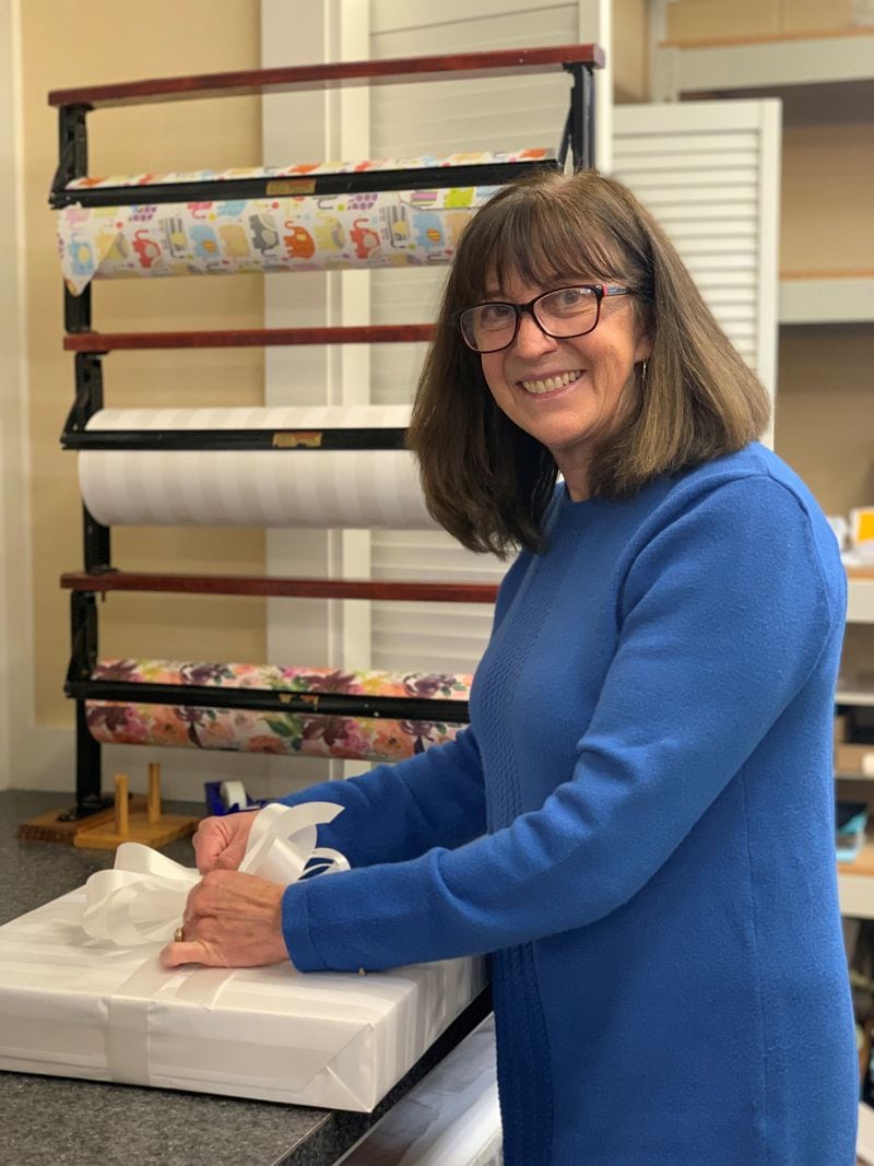 The Little Exchange gift shop benefits Dayton Children’s. Here  volunteer Julie Ferneding wraps gifts. CONTRIBUTED