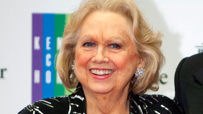 In this Dec. 7, 2013 file photo, Barbara Cook arrives at the State Department for the Kennedy Center Honors gala dinner in Washington. Cook, whose shimmering soprano made her one of Broadway's leading ingenues and later a major cabaret and concert interpreter of popular American song, has died. She was 89. (AP Photo/Kevin Wolf, File)