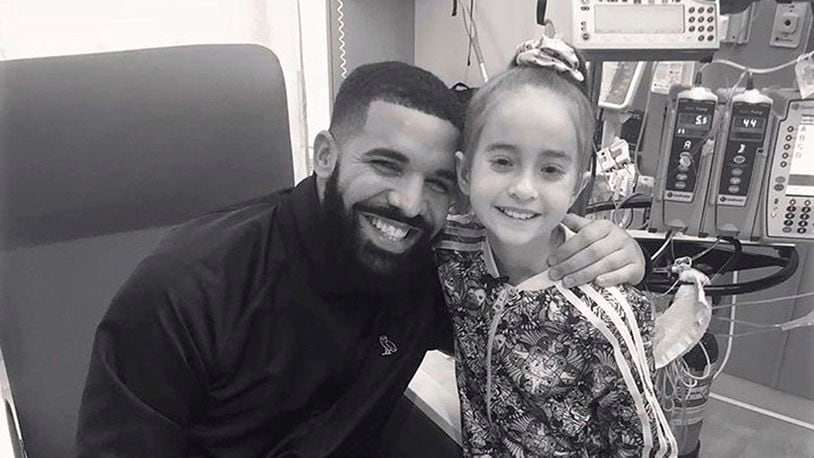 This Monday, Aug, 20, 2018 photo provided by the rapper Drake shows him posing with Sofia Sanchez, at Lurie Children's Hospital in Chicago. Drake surprised her after she recorded a video of herself dancing to the rapper's "In My Feelings" and invited him to her birthday party. Sanchez is getting a heart transplant. (OVO/Drake via AP)