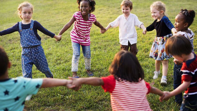 When you’re a kid, there’s not much difference between being friendly and being friends. SHUTTERSTOCK