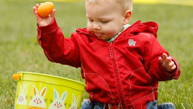A child enjoys his first Easter egg hunt in a 2012 file photo. BARBARA J. PERENIC / STAFF FILE