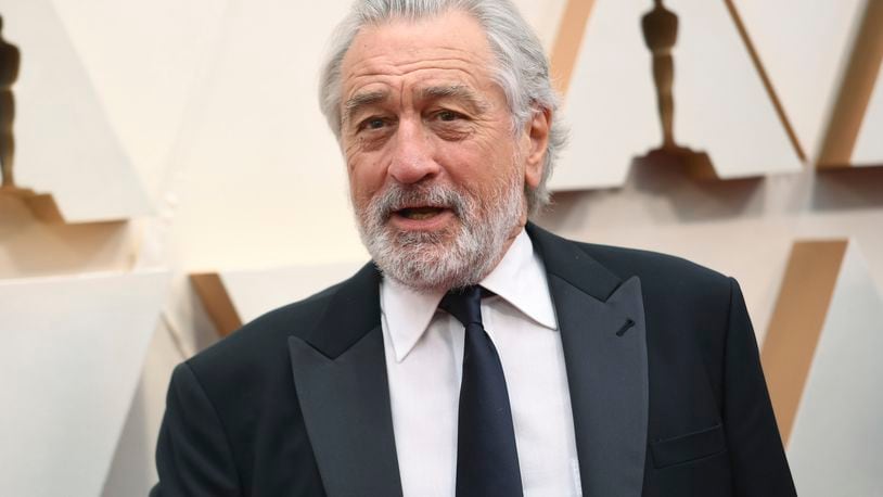 FILE - Robert De Niro appears at the Oscars in Los Angeles on Feb. 9, 2020. A leg injury may keep De Niro from celebrating the 20th Anniversary of the Tribeca Film Festival in person. The accident happened last week in Oklahoma while on location for the upcoming Martin Scorsese film, “Killers of the Flower Moon.” (Photo by Richard Shotwell/Invision/AP, File)
