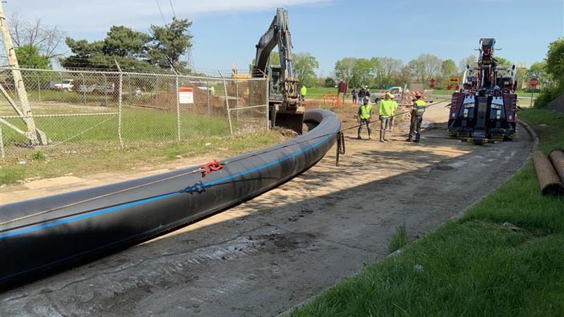 A city of Dayton crew replacing a water main pipe under the Great Miami River at the southern section of the city in 2020./ CONTRIBUTED