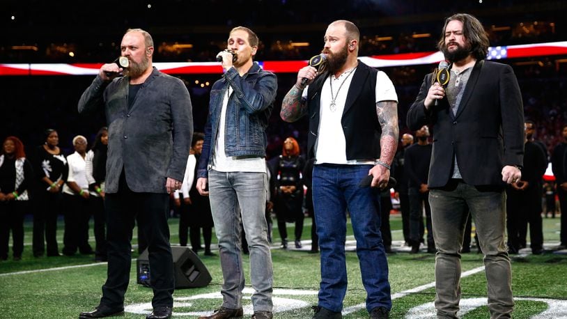 2018 Grammy nominees Zac Brown Band performs the national anthem prior to the CFP National Championship presented by AT&T between the Georgia Bulldogs and the Alabama Crimson Tide at Mercedes-Benz Stadium on January 8, 2018 in Atlanta, Georgia.  (Photo by Jamie Squire/Getty Images)