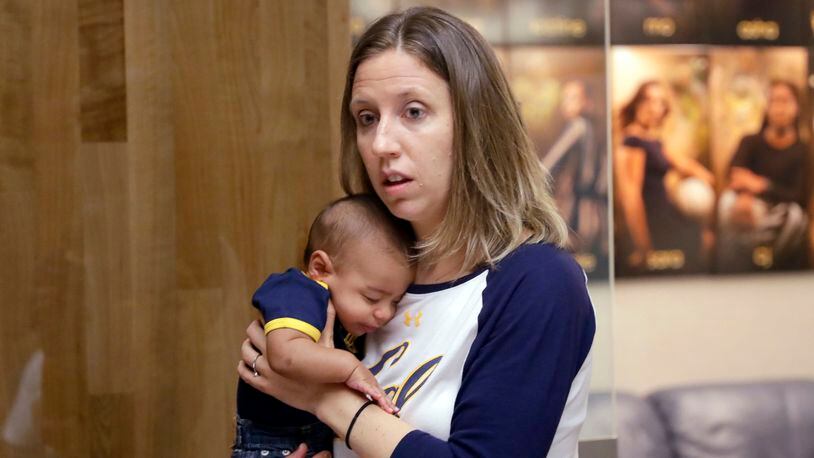 California women's basketball coach Lindsay Gottlieb holds her son, Jordan. Southwest Airlines has apologized to Gottlieb, after she claimed an airline employee stopped her from boarding because the worker didn't believe her 1-year-old biracial son was hers.