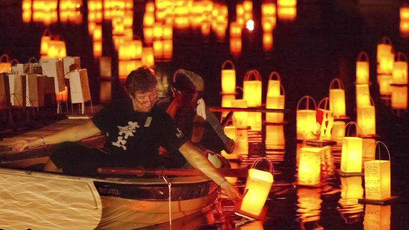 Lanterns on the water at the Morikami Pond during Bon Lantern Festival. (Greg Lovett/The Palm Beach Post)