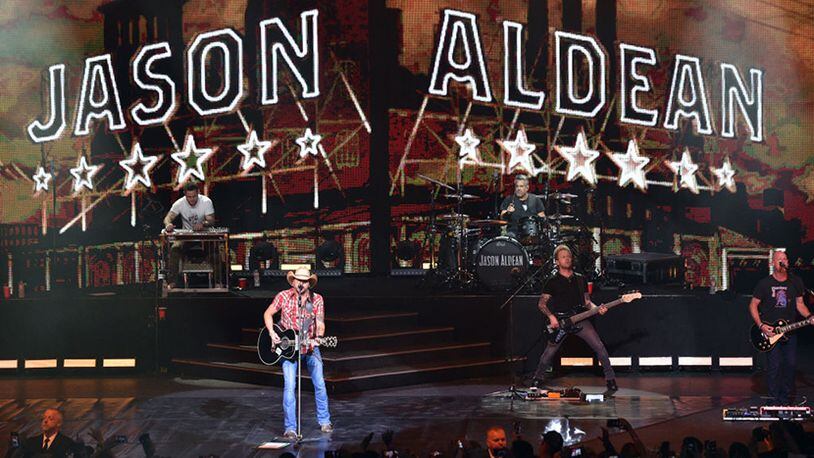 LAS VEGAS, NEVADA - DECEMBER 06: (L-R) Pedal steel guitarist Jay Jackson, recording artist Jason Aldean, drummer Rich Redmond, bassist Tully Kennedy and guitarist Jack Sizemore perform during the launch of Aldean's three-night "JASON ALDEAN: RIDE ALL NIGHT VEGAS" engagement at Park Theater at Park MGM on December 6, 2019 in Las Vegas, Nevada. (Photo by David Becker/Getty Images)