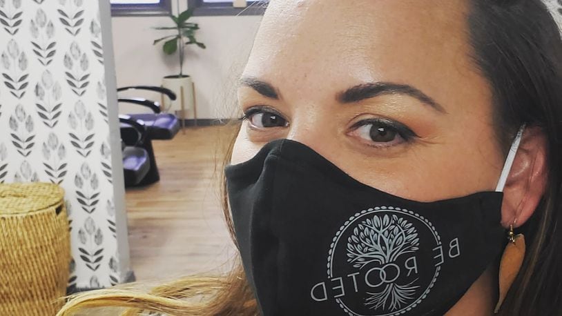 Be Rooted owner and stylist Tessa White sports a Be Rooted mask at the salon. The salon has adapted to the many changes brought on by the coronavirus pandemic. Photo courtesy of Tessa White.
