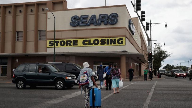 Sears is selling more than a dozen stores in an online auction.