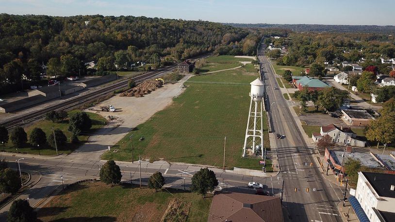 Spikeit LLC of Cincinnati wants to buy about 7 acres in West Carrollton at 200 W. Central Ave., vacant land near the top of this photo. It plans a $4.5 million facility with outdoor and indoor volleyball courts, a restaurant and a bar. The project would include 350 parking spaces. FILE