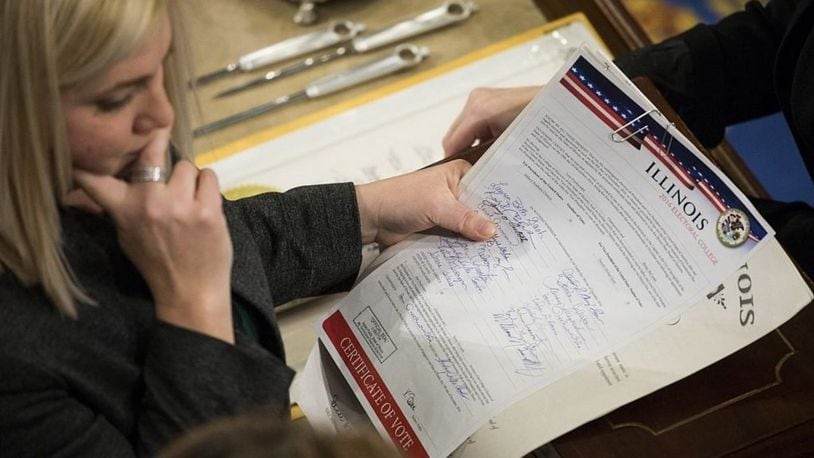 WASHINGTON, D.C.- JANUARY 6: House Clerk staff verifies the official Electoral College votes from the State of Illinois during a joint session of Congress at the U.S. Capitol in Washington, D.C.