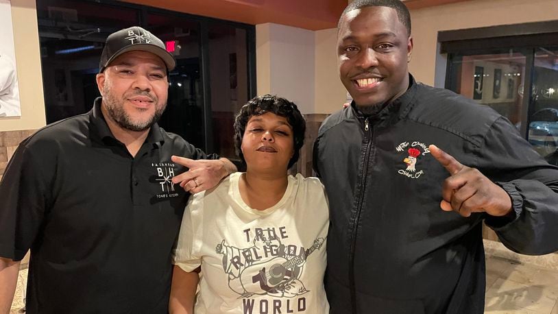 The Wing Warz Competition is from 2 to 7 p.m. at Bleachers Sport Bar and Grill, located at 4317 Linden Ave. in Riverside. Pictured (left to right) is Anthony Mitchell, Devanna Washington and Michael Baxter. NATALIE JONES/STAFF