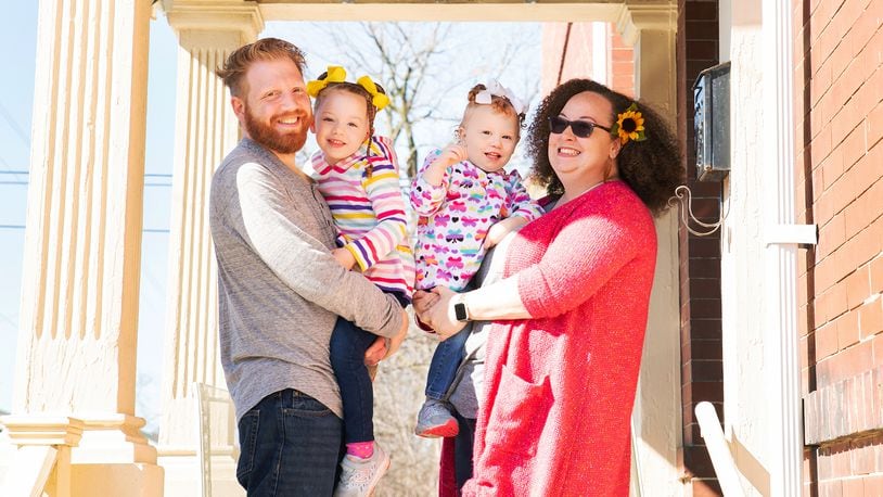 Akilah and Joe Biederman and their daughters, Eshe, 4, and Amina, 2, recently stepped onto their porch for a photo session with Jamie Cox who is participating in the Front Porch Project. JAMIE COX / J RENEE CREATIONS PHOTOGRAPHY