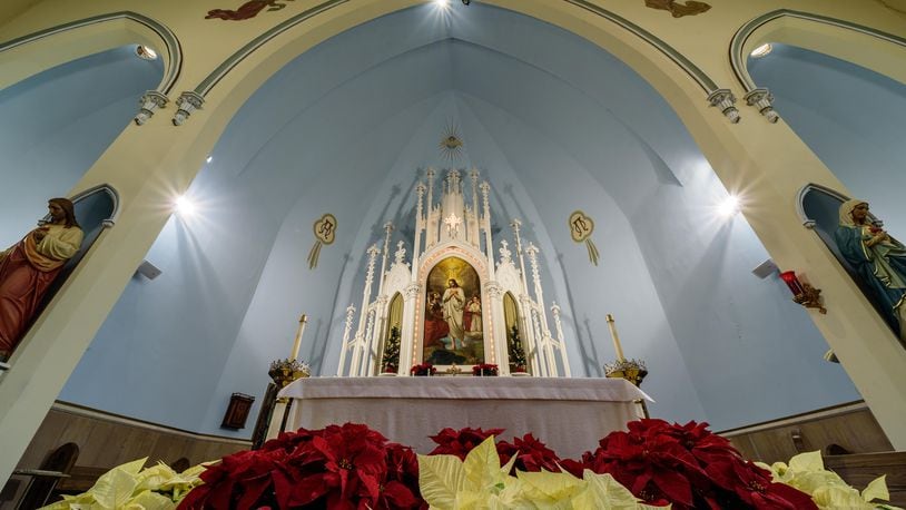Holy Trinity Catholic Church as photographed on Christmas Eve morning 2021. Located at 272 Bainbridge St. in downtown Dayton close to the Oregon District, the church was built between 1860 and 1861, making it Dayton’s oldest standing Catholic church building. TOM GILLIAM / CONTRIBUTING PHOTOGRAPHER