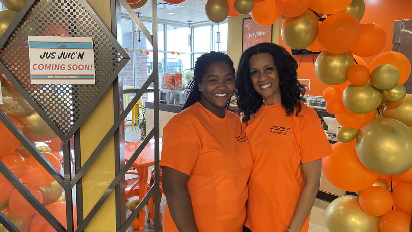 Jus Juic’n is holding a grand opening for its third location in the Dayton region inside Gem City Market at noon on Saturday, April 13. Pictured is General Manager T’Aira Scott and her mom, Shari Mann, the president of Jus Juic’n. NATALIE JONES/STAFF