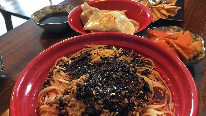 The Dan Dan noodles at Kung Fu Noodles feature kicky noodles mixed with fine ground pork, pickled long string beans, sesame paste and spicy garlic sauce. CONTRIBUTED/ALEXIS LARSEN
