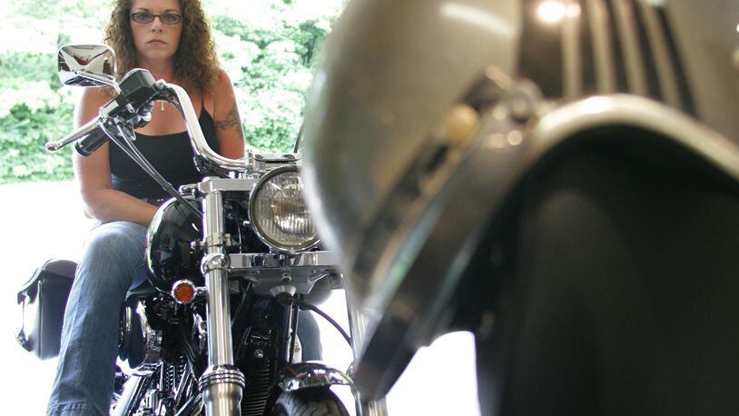 The Harley of the future may be very different from the classic machines of yore. In this 2006 file photo, Kate Barnes, of Moraine, sits on her 1999 Haley-Davidson Dyna Wide Glide. FILE