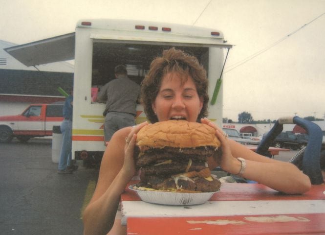 A customer holds a mega-burger from Voltzy's Hamburger & Root Beer Stand in Moraine. Archive photo courtesy of Voltzy's