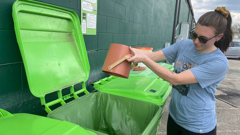 Waste-Free Dayton has teamed up with 2nd Street Market to offer a free, community compost station located on the backside of the market near Webster Street. Pictured is Natalie Warrick, founder and co-executive director of Waste-Free Dayton. NATALIE JONES/STAFF