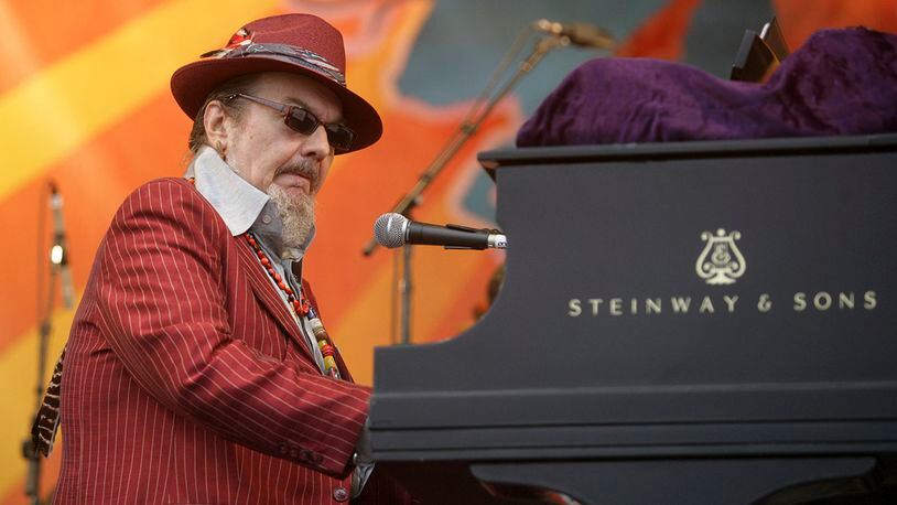 FILE - In this April 26, 2008 file photo, Dr. John performs during the 2008 New Orleans Jazz & Heritage Festival in New Orleans. The family of the Louisiana-born musician known as Dr. John says the celebrated singer and piano player who blended black and white musical influence with a hoodoo-infused stage persona and gravelly bayou drawl, has died. He was 77. A family statement released by his publicist says Dr. John, who was born Mac Rebennack, died early Thursday of a heart attack.