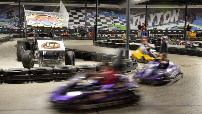 Electric go-carts zip around the track at Scene75, a perfect destination for indoor family fun. TY GREENLEES/STAFF