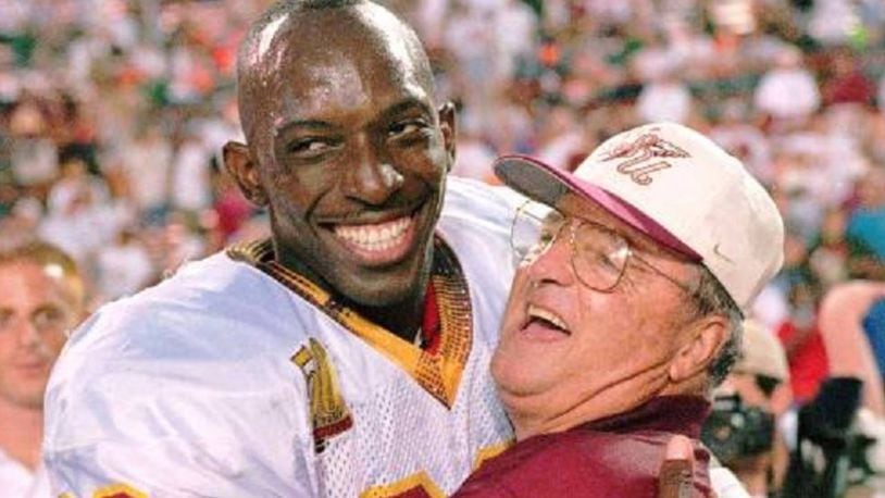 Wayne Messam and Florida State coach Bobby Bowden hugged after the Seminoles defeated the University of Miami in 1996. Messam played wide receiver at FSU.
