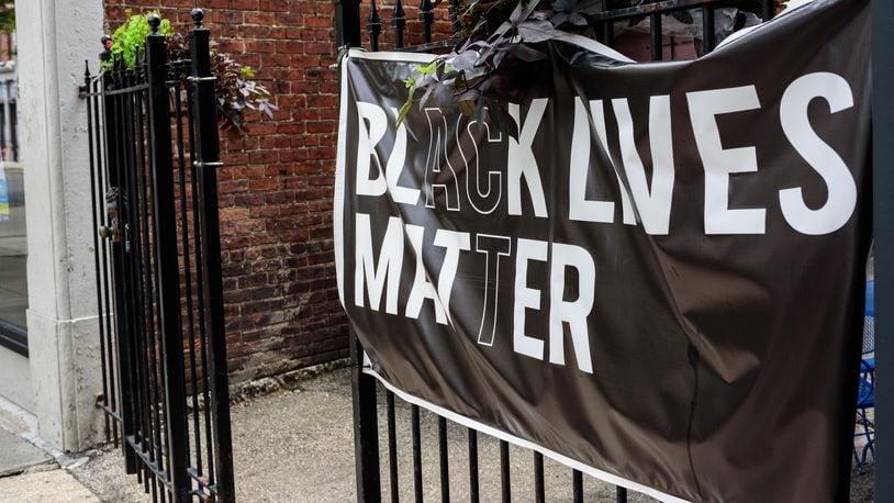 A Black Lives Matter is displayed in Dayton's Oregon District near the patio by 416 Diner on Saturday, Aug. 1, 2020. TOM GILLIAM/CONTRIBUTED