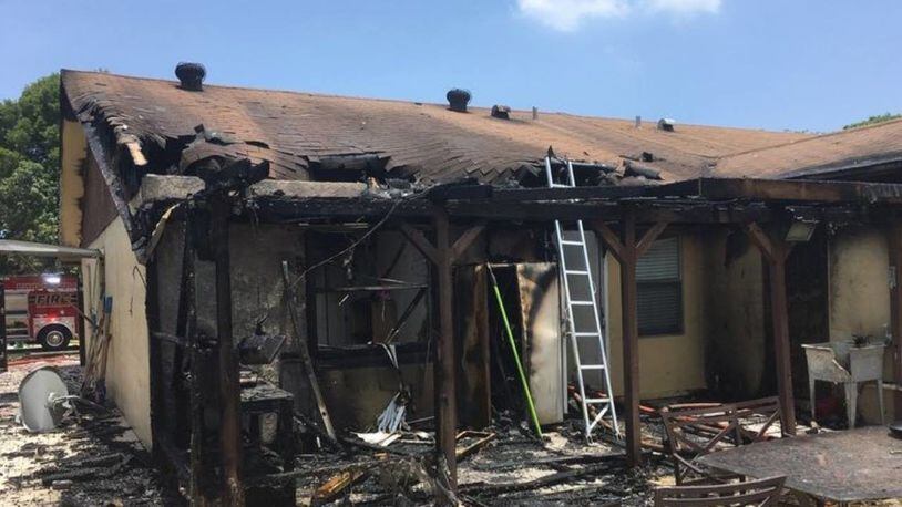 Fire engulfed a South Florida townhome after flames from a barbecue spread to the building.