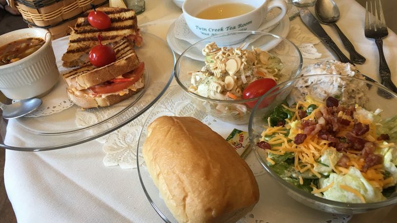 A salad sampler ($8.99) featuring a scoop of pecan chicken salad, the “Anniversary Salad” and the Tea Room Layered Salad and a grilled tuna melt ($7.99) with homemade beef vegetable soup with a cup of tea at the Twin Creek Tea Room and Ivy Parlor Gift Shop in West Alexandria. CONTRIBUTED/ALEXIS LARSEN