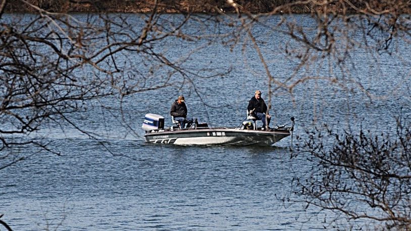 FILE PHOTO: Fisherman take advantage of sunny skies and warm weather on Eastwood Lake in February. MARSHALL GORBY / STAFF