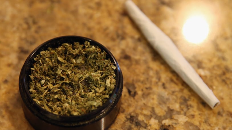 A closeup view of marijuana in a grinder along with a cigarette as photographed on August 30, 2014 in Bethpage, New York.  (Photo by Bruce Bennett/Getty Images)