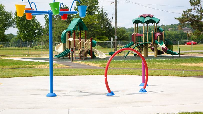 The Hamilton splash pad near the Booker T. Washington Community Center won’t be open until early July because of construction issues and weather delays. GREG LYNCH / STAFF