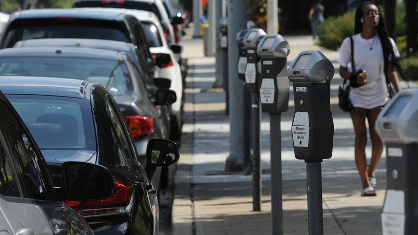 The city of Dayton has launched an app that lets drivers pay for parking on their phone instead of using a meter. MARSHALL GORBY\STAFF