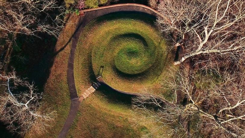 Serpent Mound's coiled tail has alignment with the summer solstice sunset.   Serpent Mound is the largest surviving ancient effigy mound in the world and is on the National Register of Historic Places.  It is located near Peebles, Ohio on State Route 73.    TY GREENLEES / STAFF