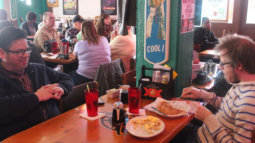 Matt J. Evans and Kyle Himsworth have lunch at Tank's Bar and Grill. Dan "Tank" Tankersley, Tank's owner, died Sunday morning.  (Photo by Amelia Robinson)