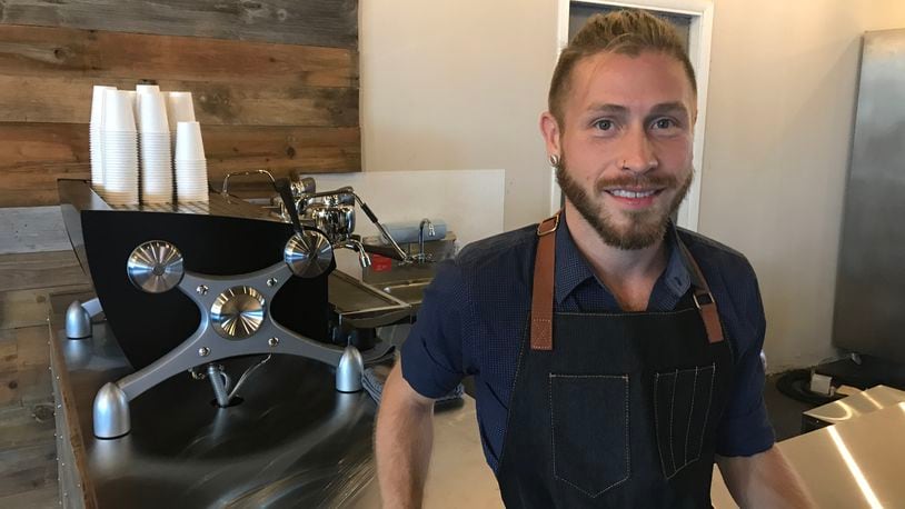 Nathan Wirrig, business owner and barista at La Gota, opened the new coffee shop today at 804 E. Monument Ave. in downtown Dayton.