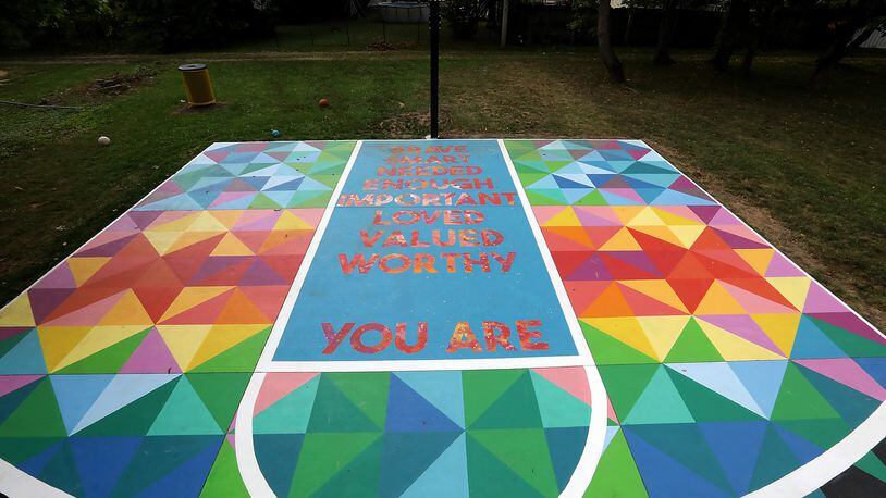 The mural painted on a basketball court in a small park along Woodward Avenue in Springfield in 2020 was made possible through a partnership between Project Jericho and The Conscious Connect, Inc. Project Jericho's next mural will be along the Springfield bike path. BILL LACKEY/STAFF