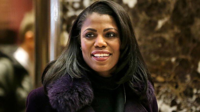 In this Dec. 13, 2016 file photo, Omarosa Manigault smiles at reporters as she walks through the lobby of Trump Tower in New York. Manigault Newman is following up her year in the White House with a stint on "Celebrity Big Brother." CBS unveiled the cast of the reality show's upcoming season Sunday with a commercial that aired during the Grammy Awards.
Besides Manigault Newman, other contestants include basketball star Metta World Peace and actresses Marissa Jaret Winokur and Keshia Knight Pulliam.  (AP Photo/Seth Wenig)