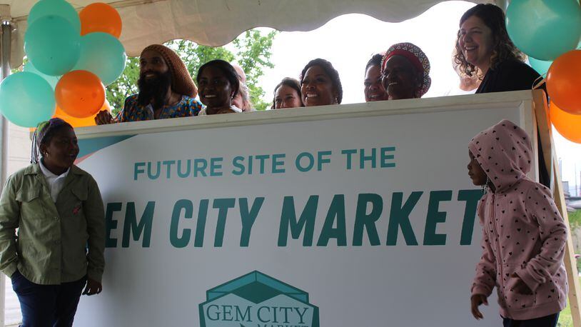 Supporters of the Gem City Market at the proposed site of the grocery store on the 300-400 blocks of Salem Avenue. CORNELIUS FROLIK / STAFF