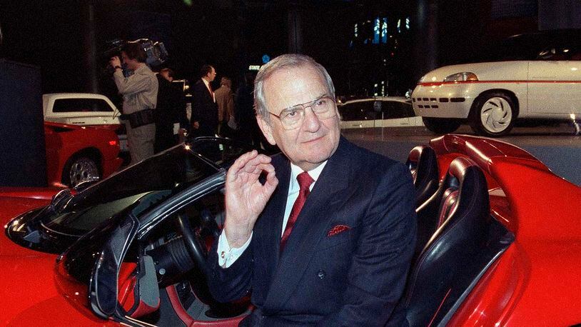 1990, file photo, Chrysler Corporation Chairman Lee Iacocca sits in a 1990 Dodge Viper sports car. (AP Photo/Osamu Honda, File)