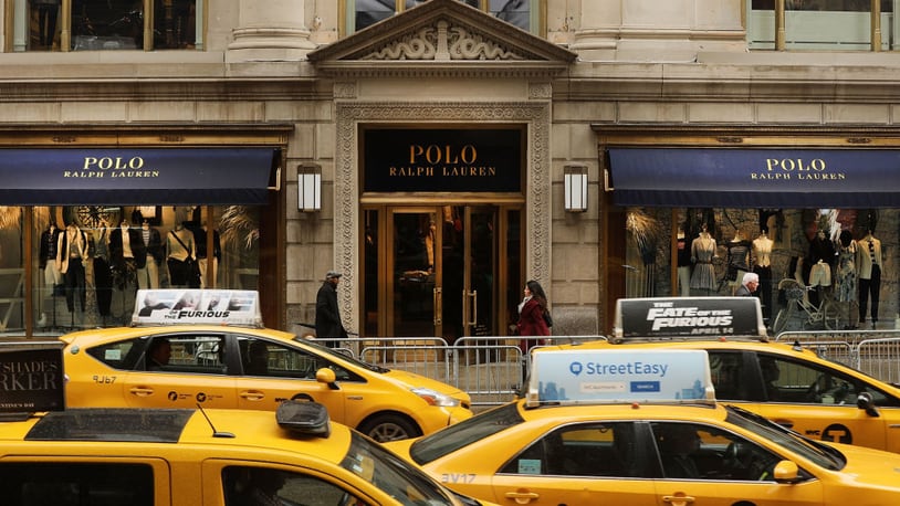 NEW YORK, NY - APRIL 04: People walk by  Ralph Lauren's Fifth Avenue Polo store on April 4, 2017 in New York City. The luxury brand announced on Tuesday that it will close the exclusive location, just  doors down from Trump Tower. The iconic clothing company has struggled financially as more shoppers migrate to online shopping among other consumer challenges. (Photo by Spencer Platt/Getty Images)