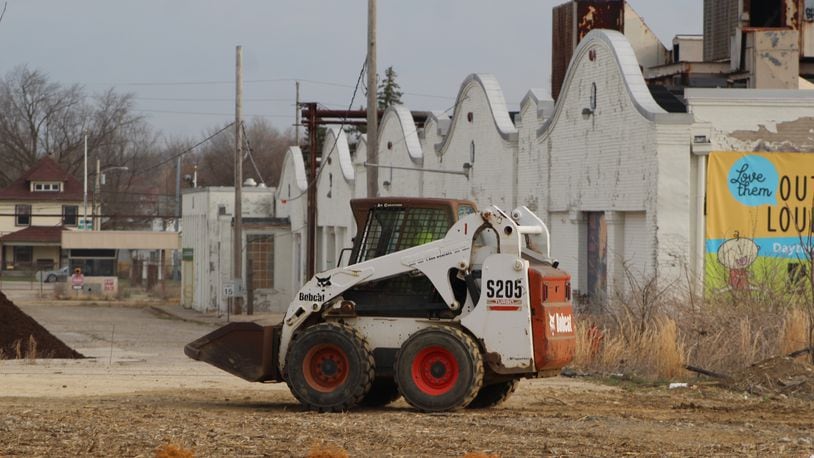 A Bobcat skid-steer loader works near the Wright brothers airplane factory site in West Dayton. CORNELIUS FROLIK / STAFF