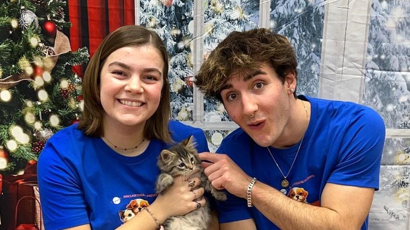 Amelie De la Nuez as Kia, the cat, and Ethan Harris as Duffy, the dog, get character development tips at the Humane Society on becoming rescue animals for their roles in Sinclair Theatre's "'Twas the Night Before Christmas and We're Home Alone!" in Blair Hall Dec. 14-17. PHOTO BY PATTI CELEK