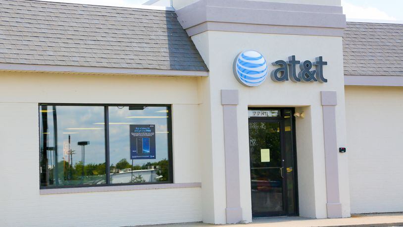 AT&T plans to open 1,000 stores in dense urban areas and mobile pop-up shops. GREG LYNCH / STAFF