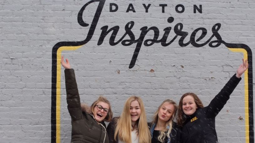 Oakwood High School sophomores ( left to right)   Ryann Mescher, Dana Clark , Zoe Waller and  Claire Parker launched the Femme Aid Collaborative to  address period poverty in the Dayton area. They are pictured in the Oregon District.