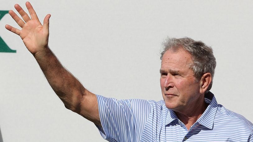 JERSEY CITY, NJ - SEPTEMBER 28:  Former U.S. President George W. Bush waves to the crowd (Photo by Sam Greenwood/Getty Images)